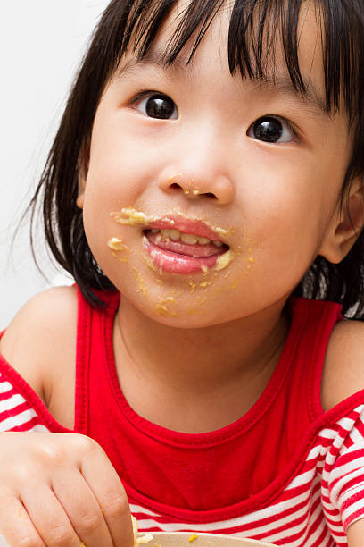 istock Chinese Girl Eating Durian 477775978