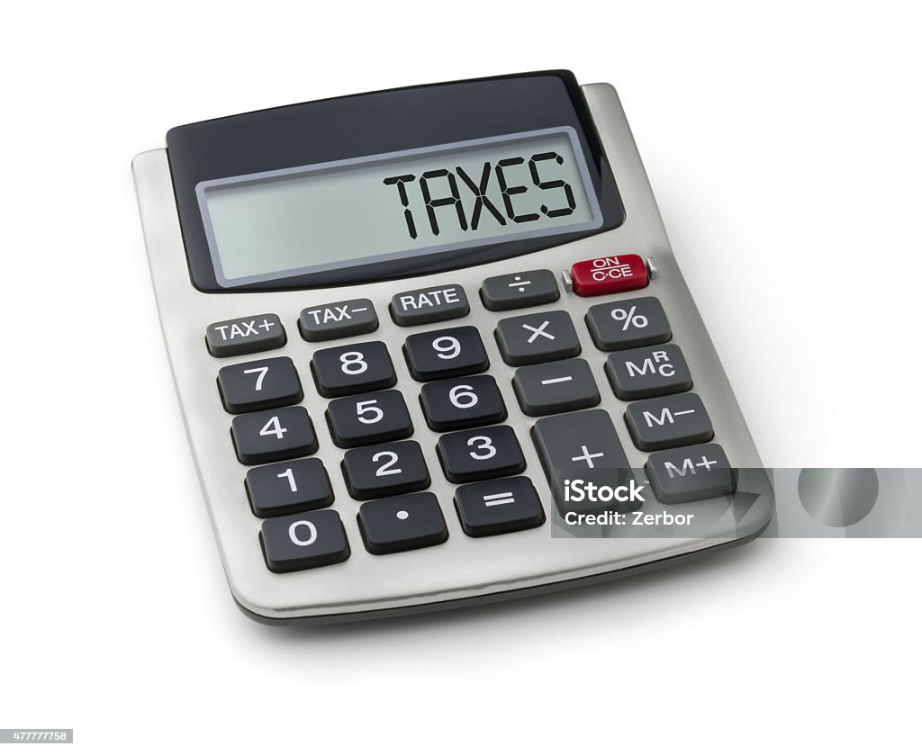 Calculator with the word taxes on the display Tax Form Stock Photo