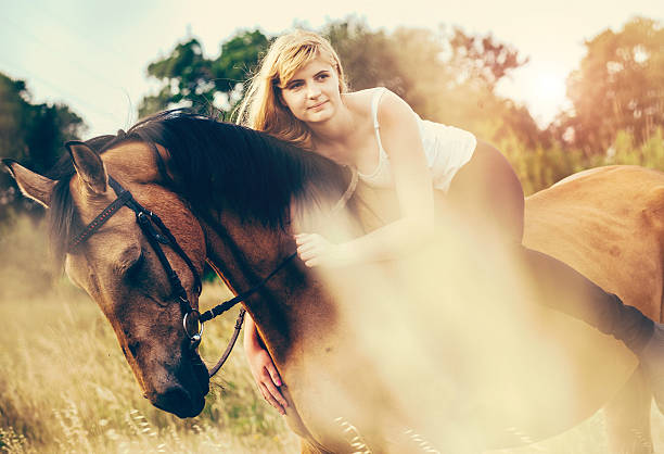 istock Young woman riding a horse in nature 477777976