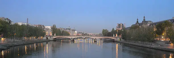 View of the Pont du Carrousel from the Pont des Arts at sunrise in late September. Louvre museum appears on the right of the picture, and further on the left, Orsay museum.