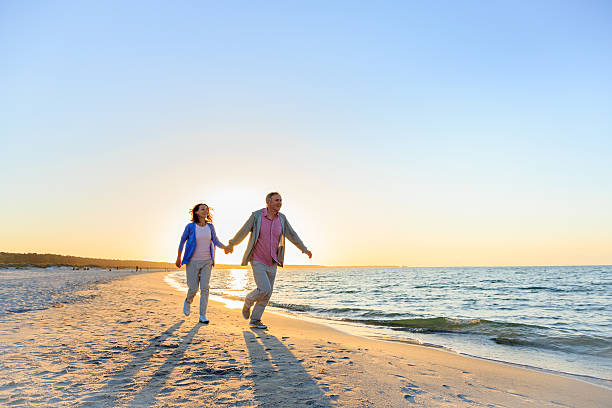 istock Happy mature couple outdoors on the beach 477779348