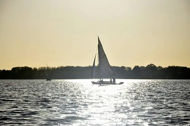Sailingboat in sunset Reeuwijk