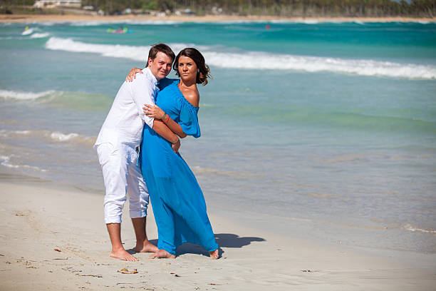 istock Beach couple walking on romantic travel. 477779568