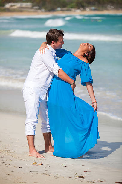 istock Beach couple walking on romantic travel. 477779578