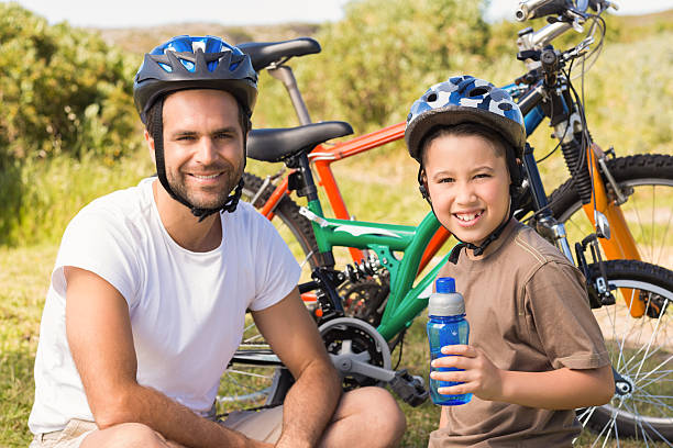 istock Father and son on a bike ride 477780420