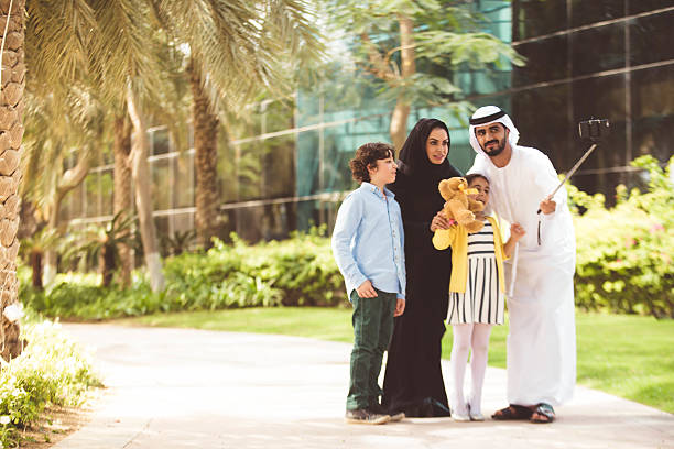 istock Young Arab family in a park taking selfie 477783466
