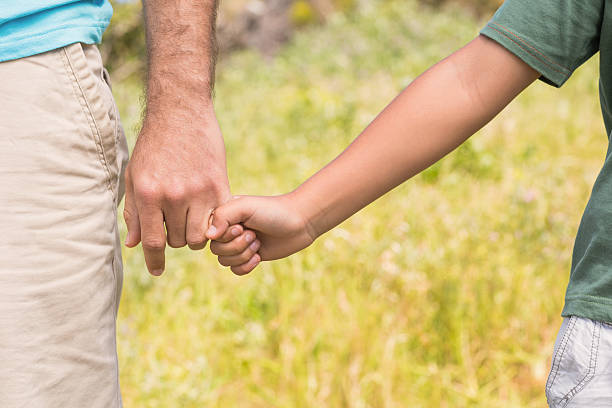 istock Father and son in the countryside 477783628
