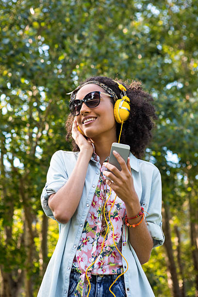 istock Pretty hipster listening to music 477784154