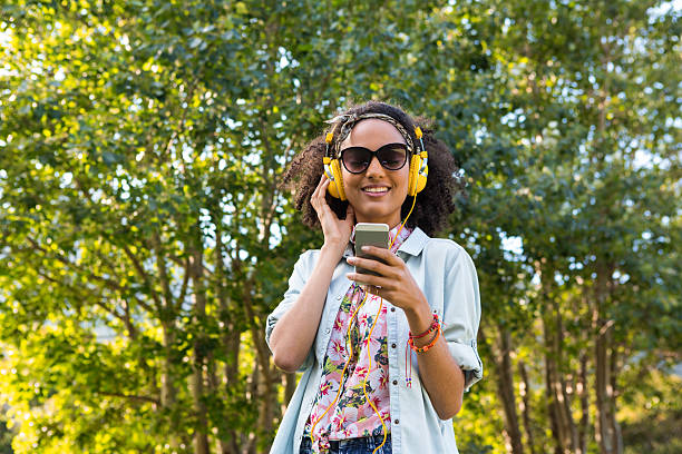 istock Pretty hipster listening to music 477784168