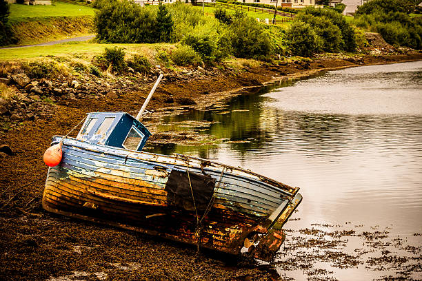 Abandon damaged boat by the lake