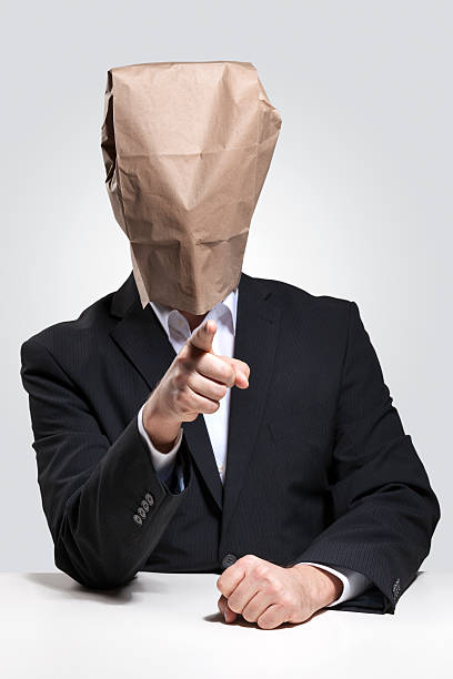 istock Man with paper bag on his head 477788153