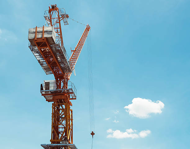 istock Industrial Crane lifting with blue sky and cloud 477792118