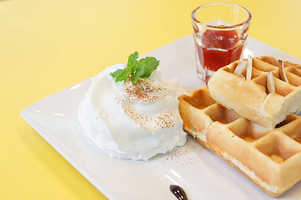 istock Strawberry Waffle whipped Cream on yellow desk 477792252
