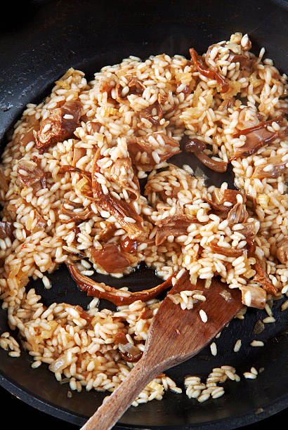 istock risotto with mushrooms in pan 477792820