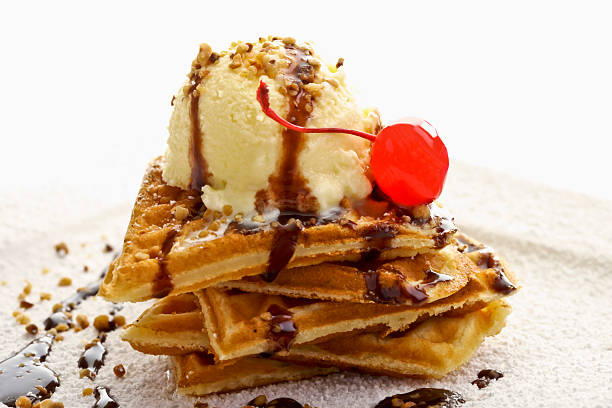istock Heart-shaped waffles with vanilla icecream, chocolate sauce and cherry 477793426