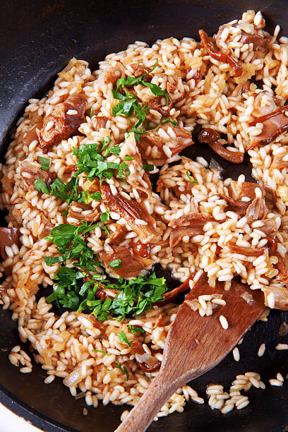 istock risotto with mushrooms in pan 477794588
