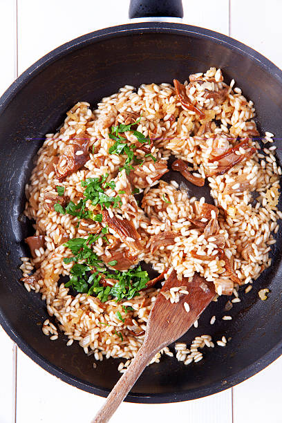 istock risotto with mushrooms in pan 477795962