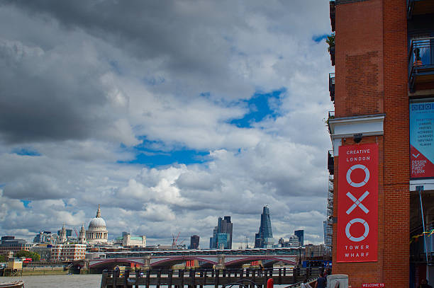 London, United Kingdomy - September 7, 2013: A view of the Thames and London skyline looking North East from the south bank and showing St Paul's Cathedral on the left and continued construction and the newly created skyscraper landmarks, Canary Wharf, The Walkie Talkie and the Cheese Grater' . Blackfriars Bridge is at the bottom of the shot with the OXO buidling on th far right.