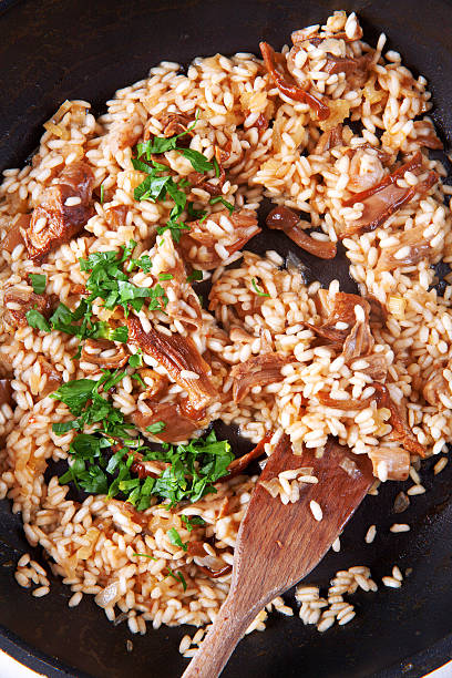 istock risotto with mushrooms in pan 477800092