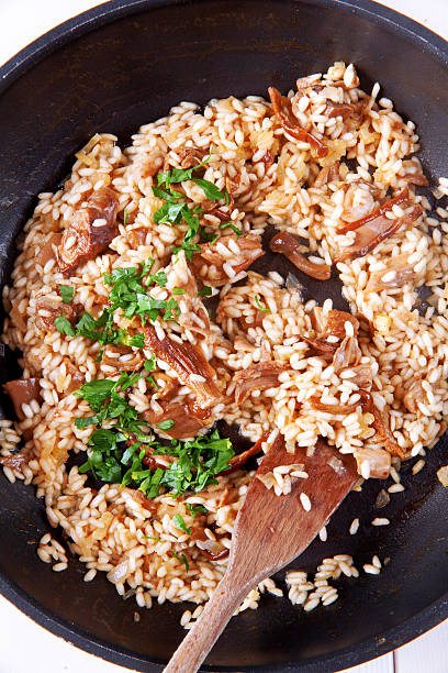 istock risotto with mushrooms in pan 477800518