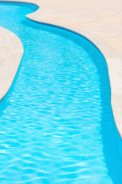 istock Blue rippled water at swimming pool 477803409