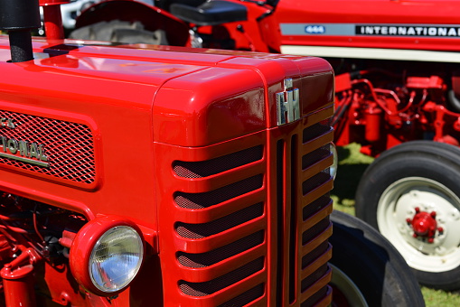 Jersey, U.K. - June 6, 2015: IH International tractors a vintage static display at Jersey's car festival.