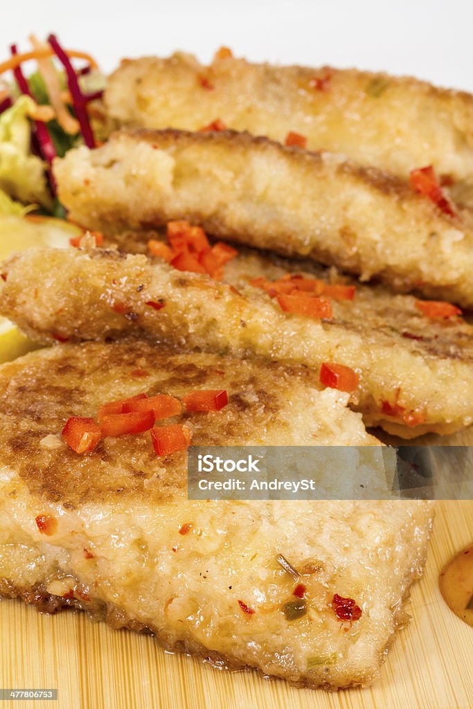 Fried fish fillets with  salad. Brunch Stock Photo