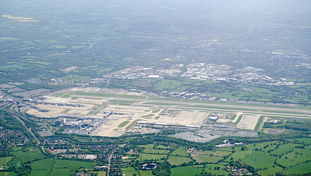 Gatwick Airport, aerial view View from above of the runway and terminals at London's Gatwick Airport in Sussex, England.  The airport management would like to expand to two runways. gatwick airport photos stock pictures, royalty-free photos & images