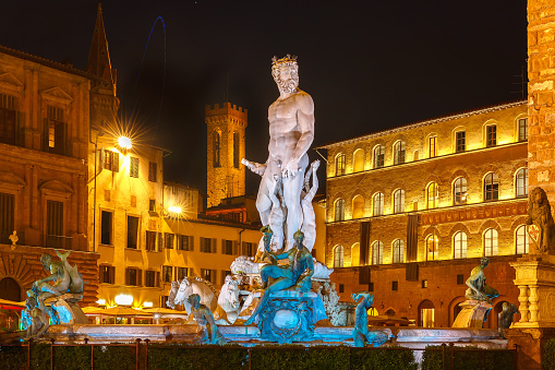 Fountain of Neptune by Bartolomeo Ammannati on  Piazza della Signoria in Florence at night, Italy