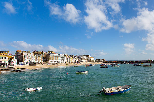 St Ives Cornwall England with boats in the harbour and blue sea and sky in this traditional Cornish fishing town in the UK