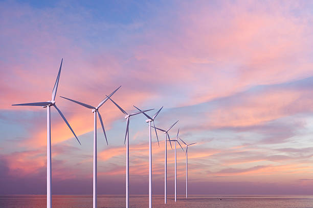 istock Wind generators turbines in the sea on sunset 477812447