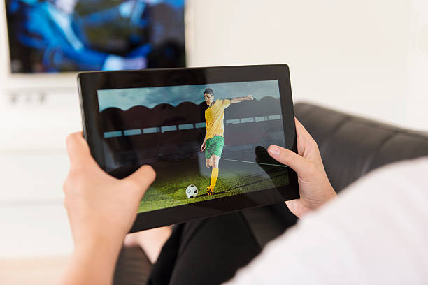 istock Watching soccer game on a digital tablet 477813089