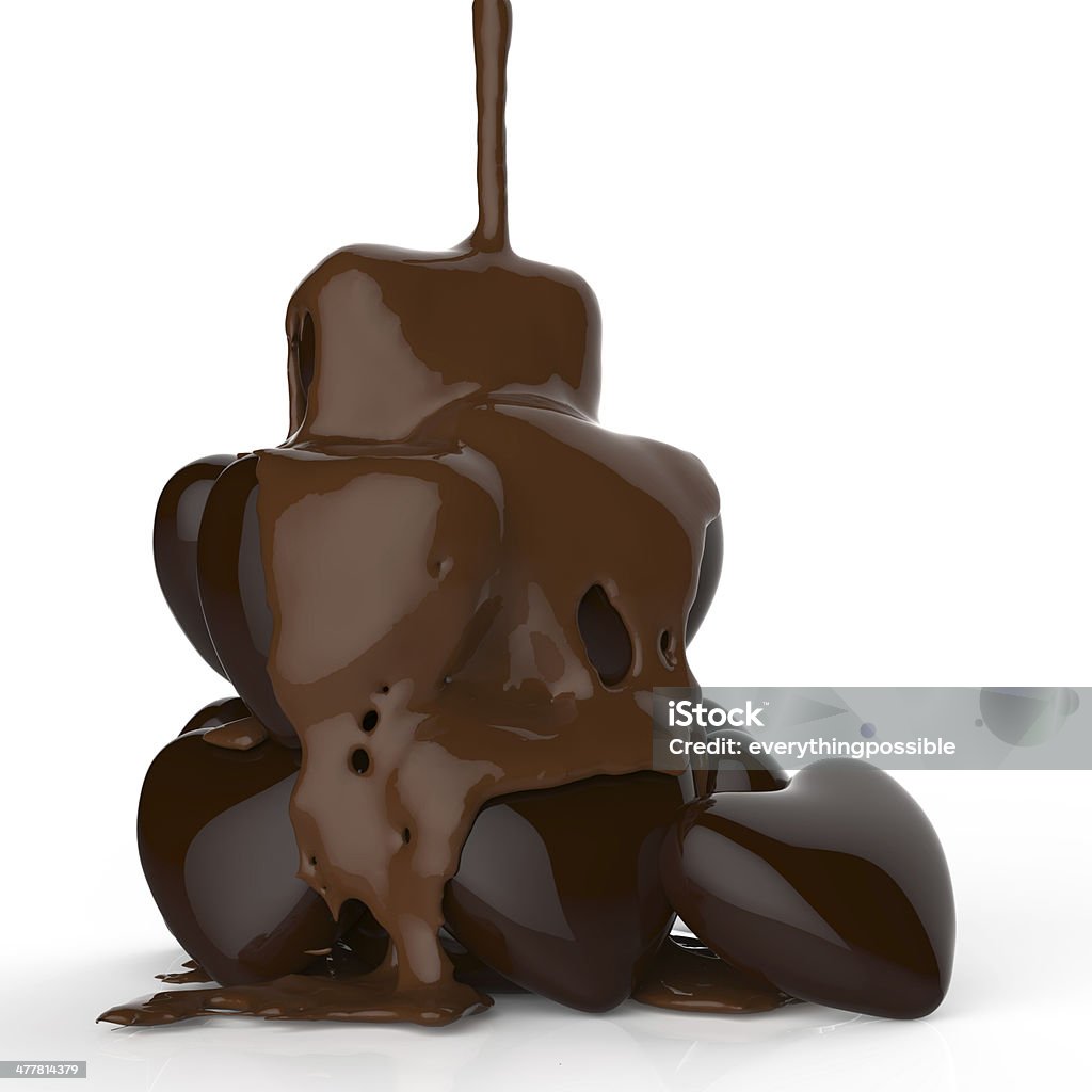 close up chocolate syrup leaking over heart shape symbol close up chocolate syrup leaking over heart shape symbol on white background Blob Stock Photo