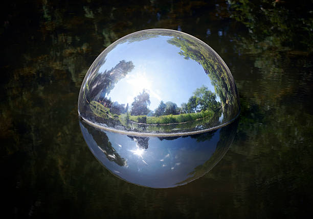 istock Reflections of a park in a chrome sphere 477814946