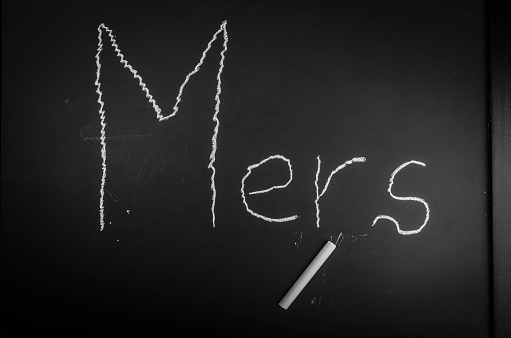 The word MERS on a black chalkboard.