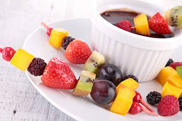istock chocolate sauce and fruits 477817829
