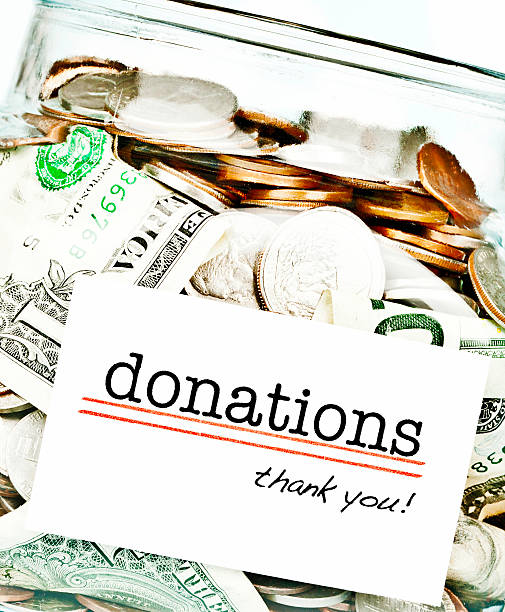 istock Donations Jar Filled with American Money 477818423