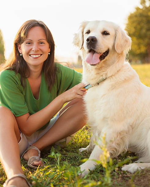 istock Young woman with dog 477820045