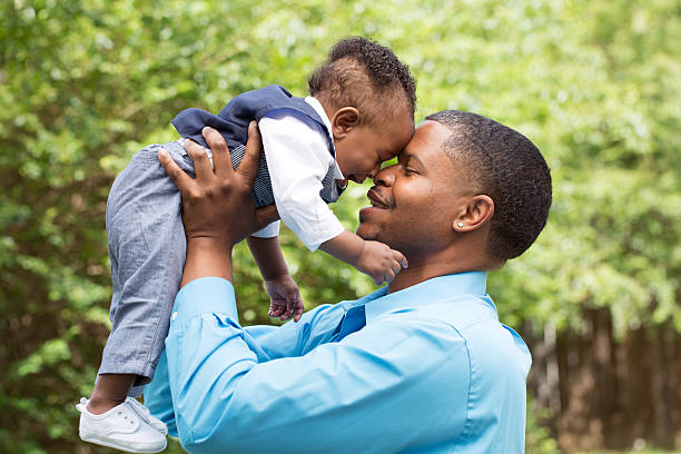 istock African American father and son playing 477820056