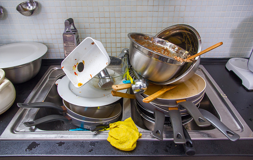 Heap of dirty utensil on the kitchen