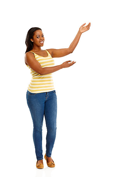 istock Beautiful young woman displaying copyspace 477820617