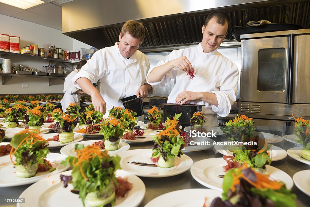 Plating Up Chef`s plating up a salad course Chef Stock Photo