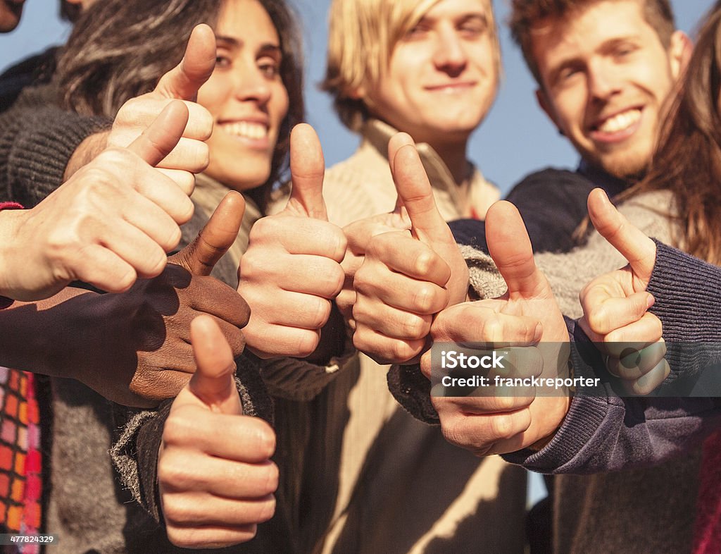 multiracial thumbs up http://blogtoscano.altervista.org/tm.jpg  Cheerful Stock Photo