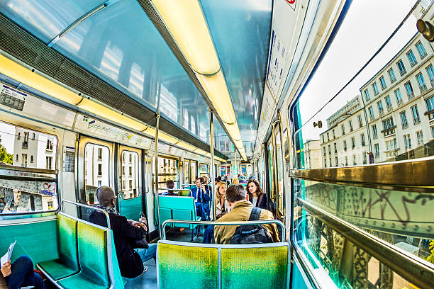 Paris, France - June 10, 2015: Tourists and locals on a subway train in Paris, France. More than 30 million people visit Paris annually.