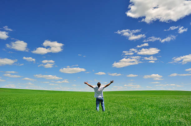 istock man on the field under beautiful sky 477827512