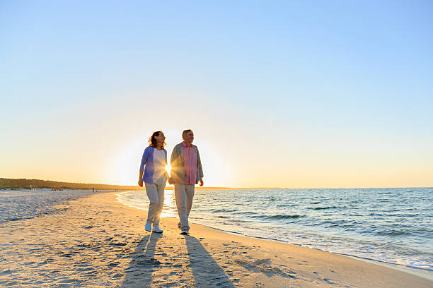 istock Happy mature couple on the beach 477827726