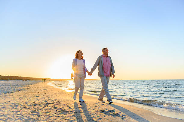 istock Happy mature couple outdoors on the beach 477827728