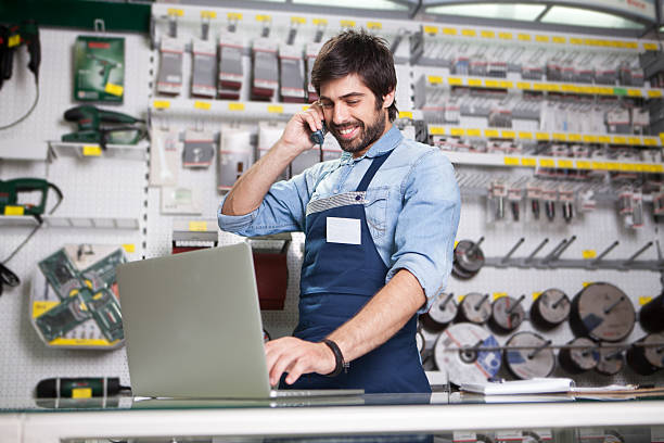 Man working at a hardware store stock photo