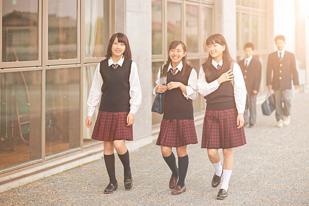 istock Japanese students walking outside the school yard 477829234