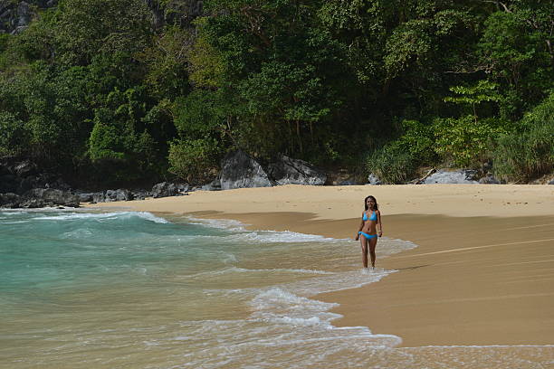 Fashion shot of a Philippina on the Exotic beach Fashion shot of a Philippina on the Exotic beach near El Nido City, Palawan Island summer fashion philippines palawan stock pictures, royalty-free photos & images